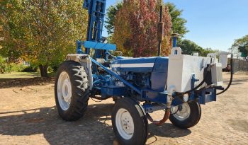 FORD TRACTOR WITH DRILL ATTACHMENT