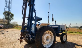 FORD TRACTOR WITH DRILL ATTACHMENT