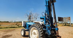 FORD TRACTOR WITH DRILL ATTACHMENT