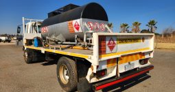 2009 MITSUBISHI FUSO INTERCOOLED FM14-213 FLAT DECK WITH FUEL TANKER